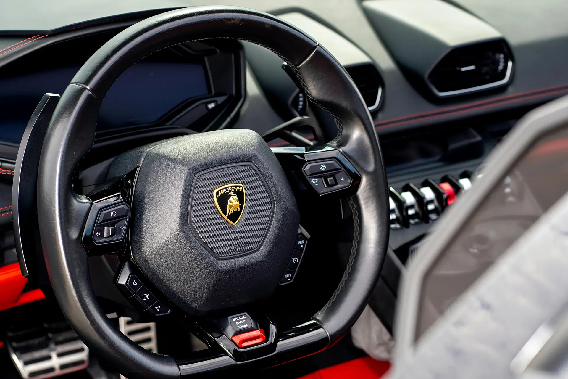 Lamborghini steering wheel and interior of vehicle